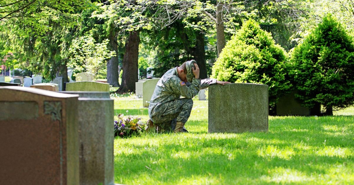 Soldier visiting another soldier's grave; Memorial Day
