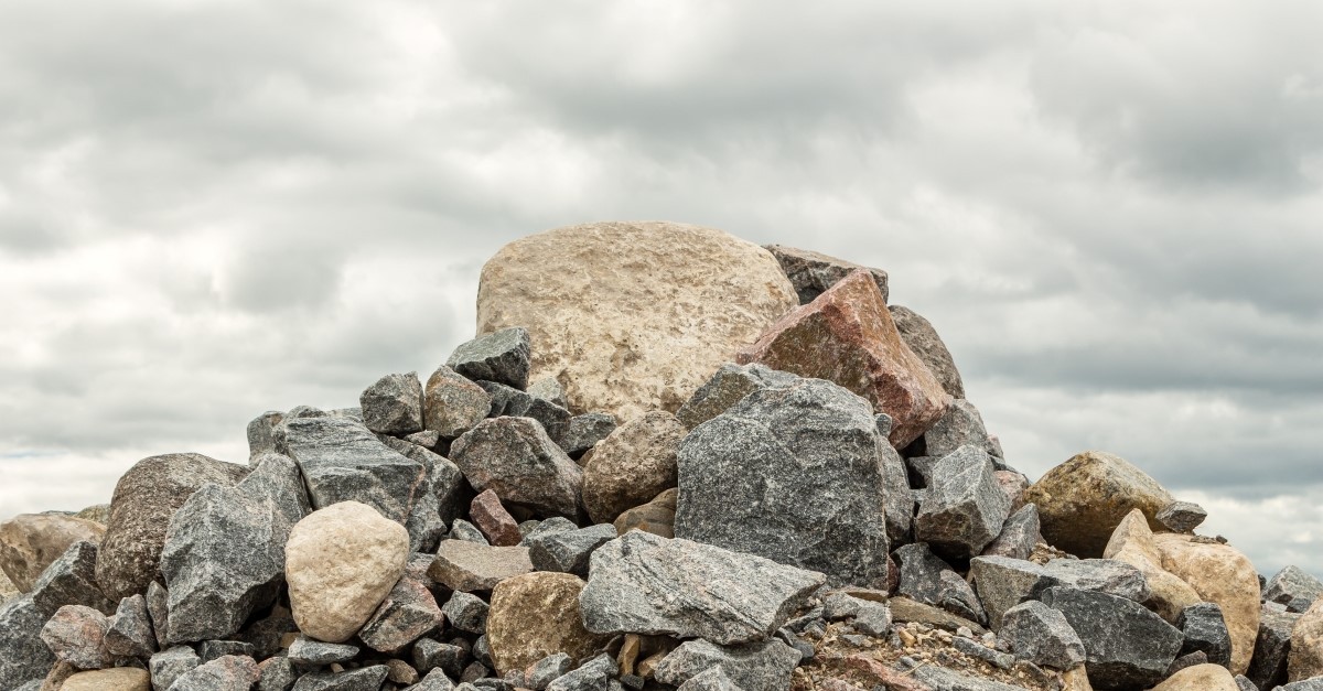 large rock on top of rock pile to illustrate the stone the builders rejected