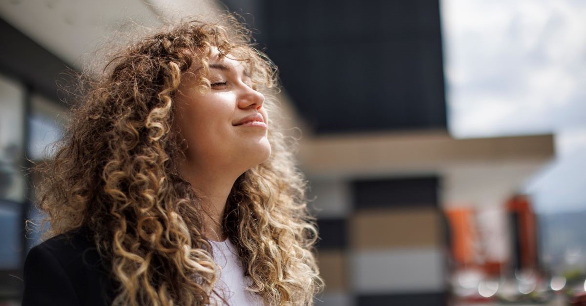 happy eyes closed content free light outside woman girl