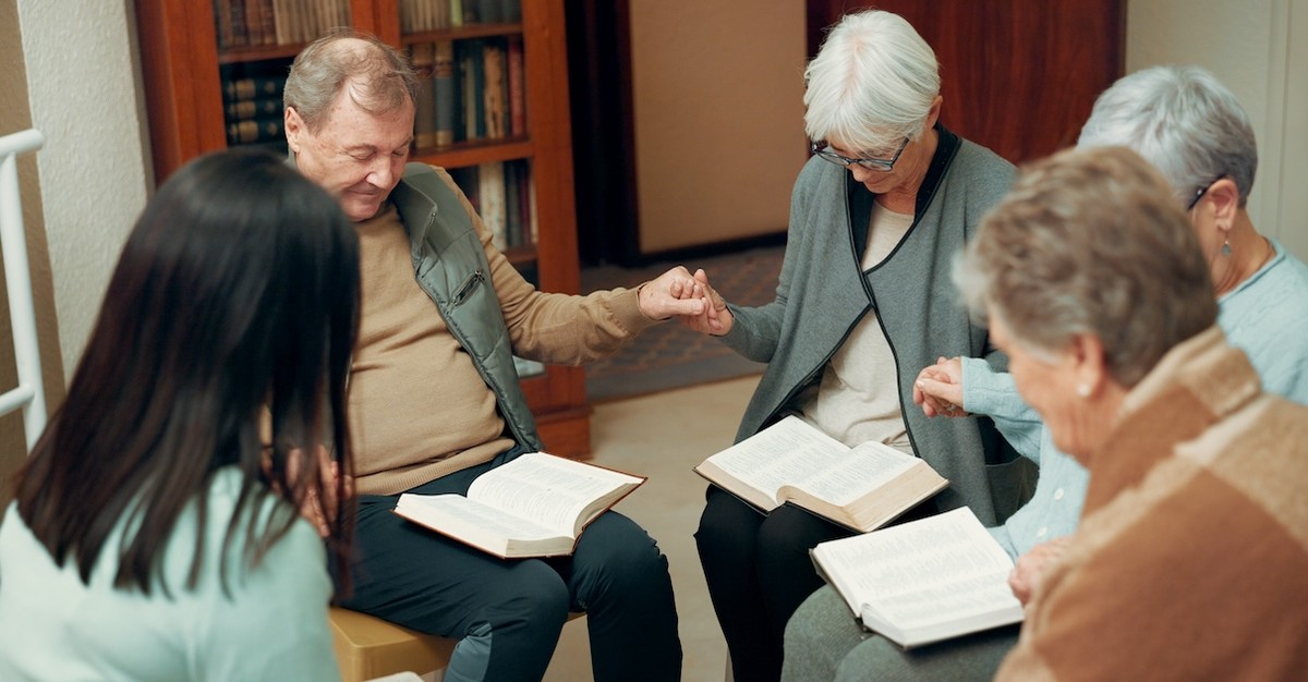 Christian seniors praying at church Bible Study; closing prayer for wisdom