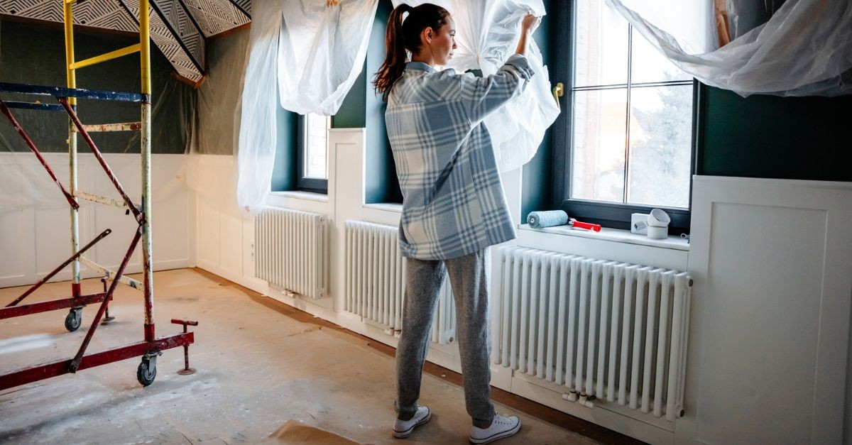 Woman Working on Her House