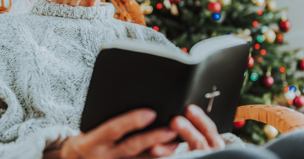 Woman reading Bible Christmas tree Bible Study