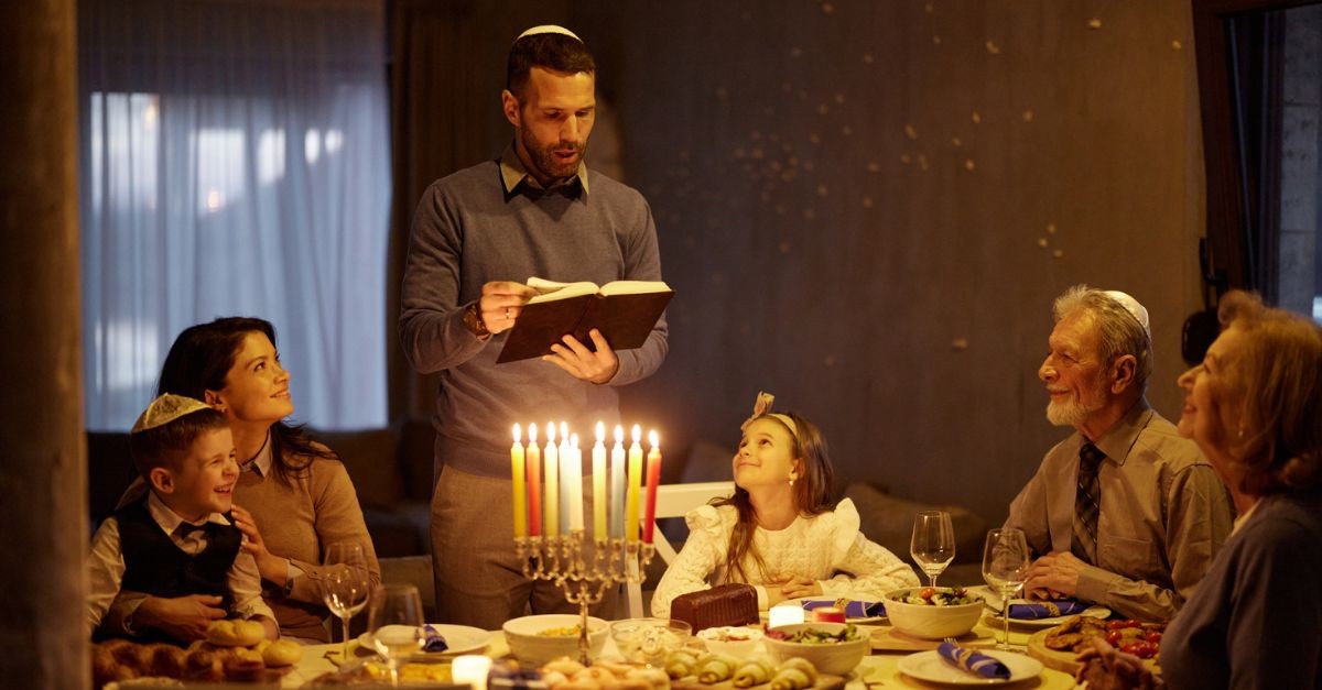 Family celebrating Hanukkah; what is the spiritual significance of Hanukkah?