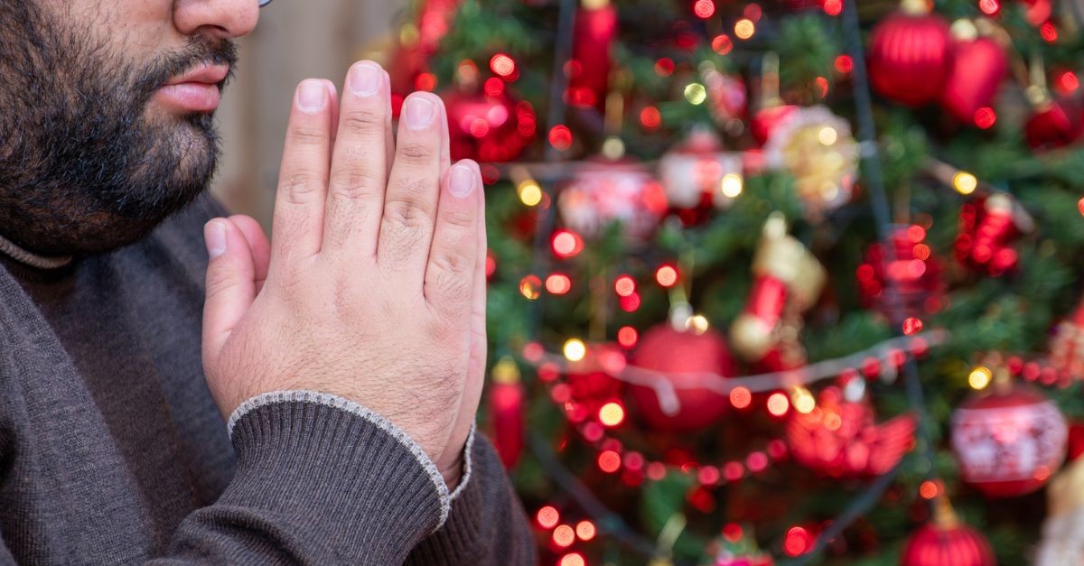 Man praying at Christmas; what does God want from us this Christmas?