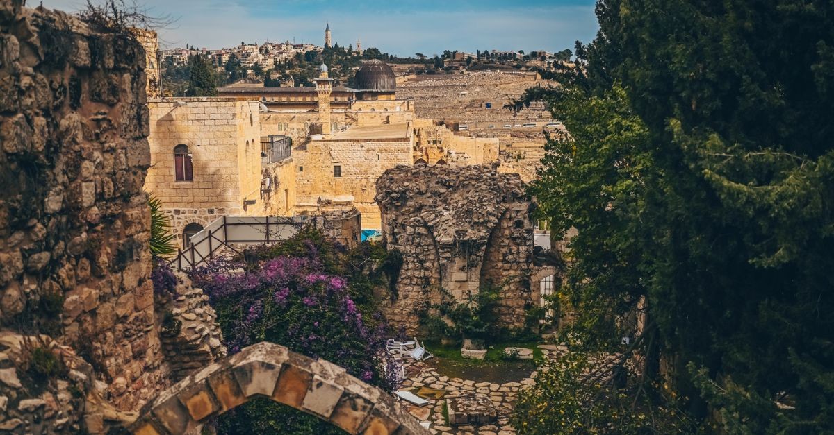 Cozy narrow small Street in the Old City of Jerusalem, Israel. Typical stoned houses and walls of jewish historic quarter area part.