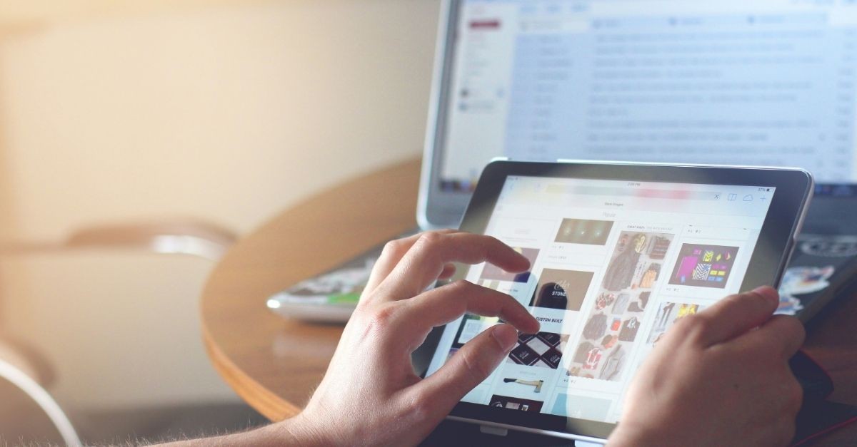 Woman on several devices; pandemic level of stress