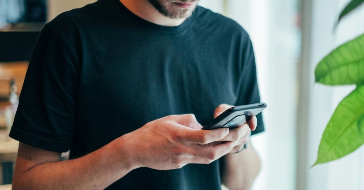 Man texting; information overload and your spiritual life ...eek.