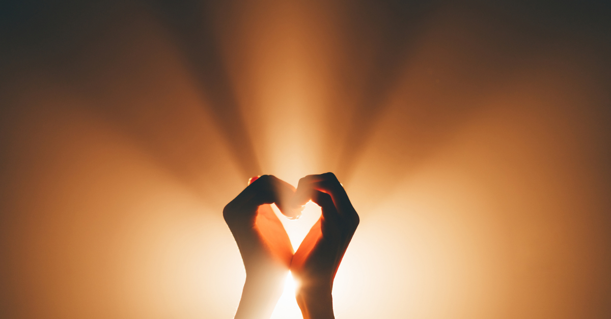 Hands lifted in prayer or open toward light