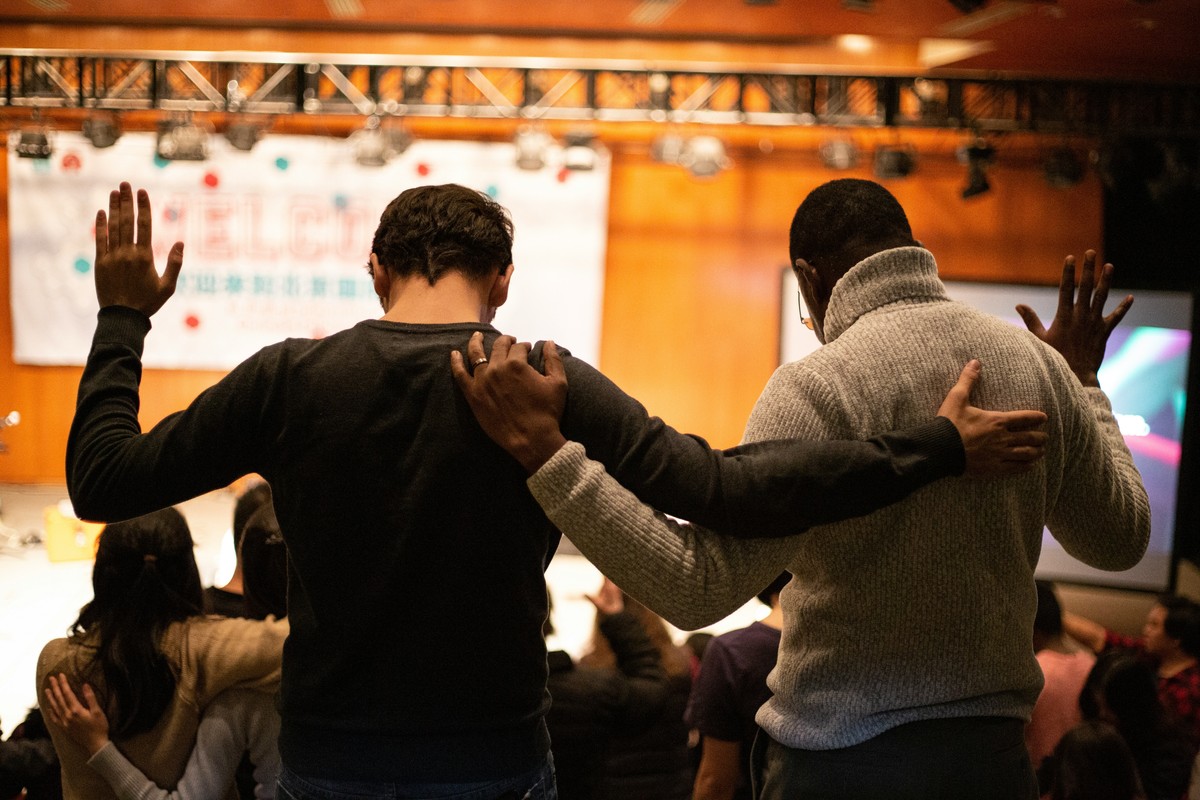 Men Worshipping Together in Church