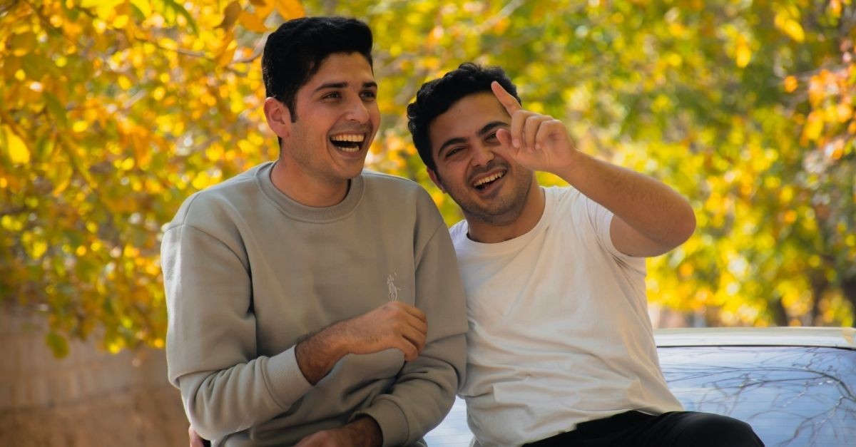 Friends laughing outside in the fall; how to be authentic regardless of circumstance