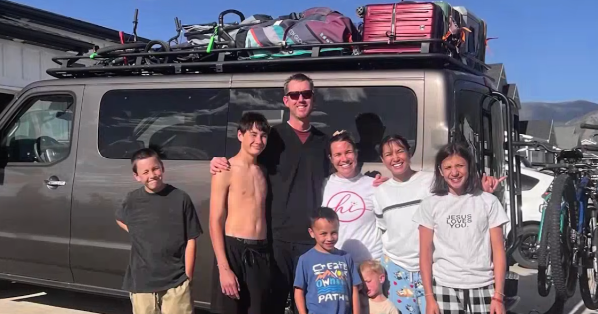 family standing in front of van