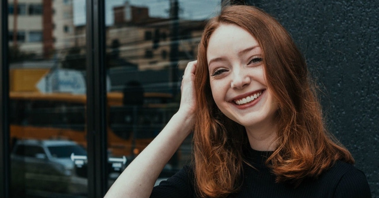 smiling woman looking into camera