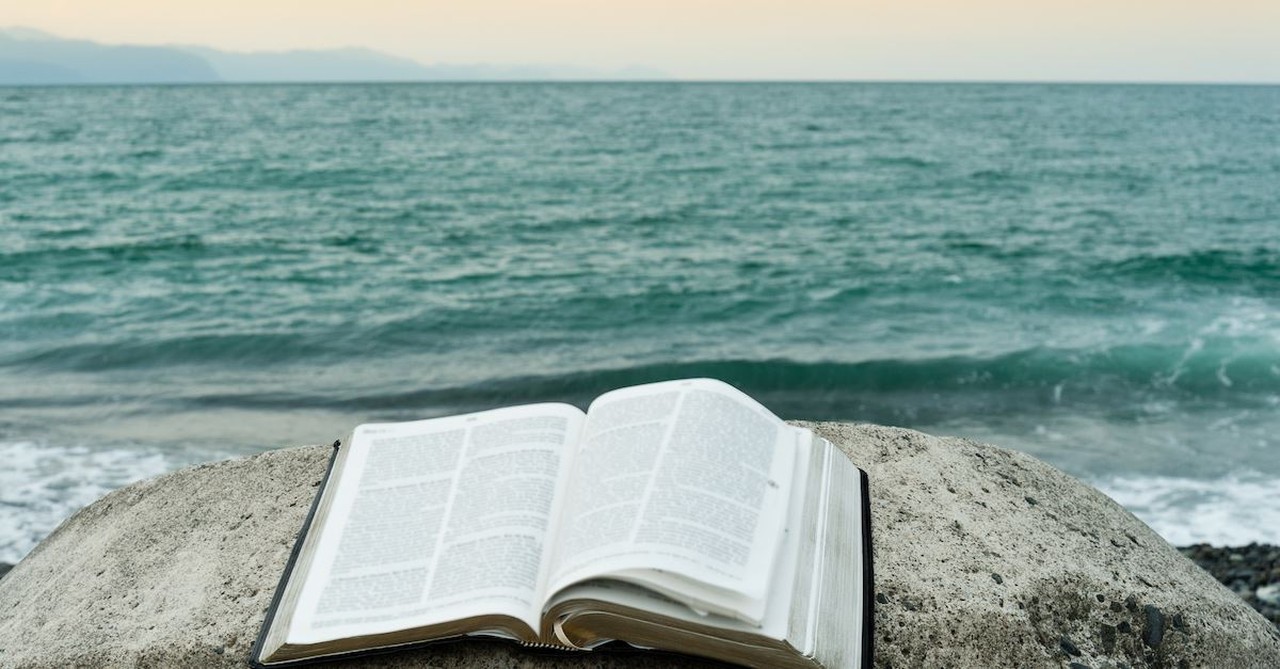 bible near an ocean, god shows up in our darkest hours