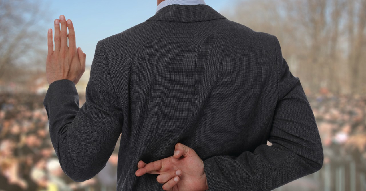 Man crossing his fingers behind his back