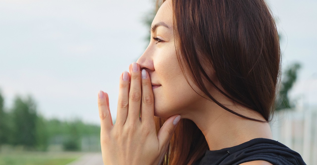 woman looking peaceful and thoughtful