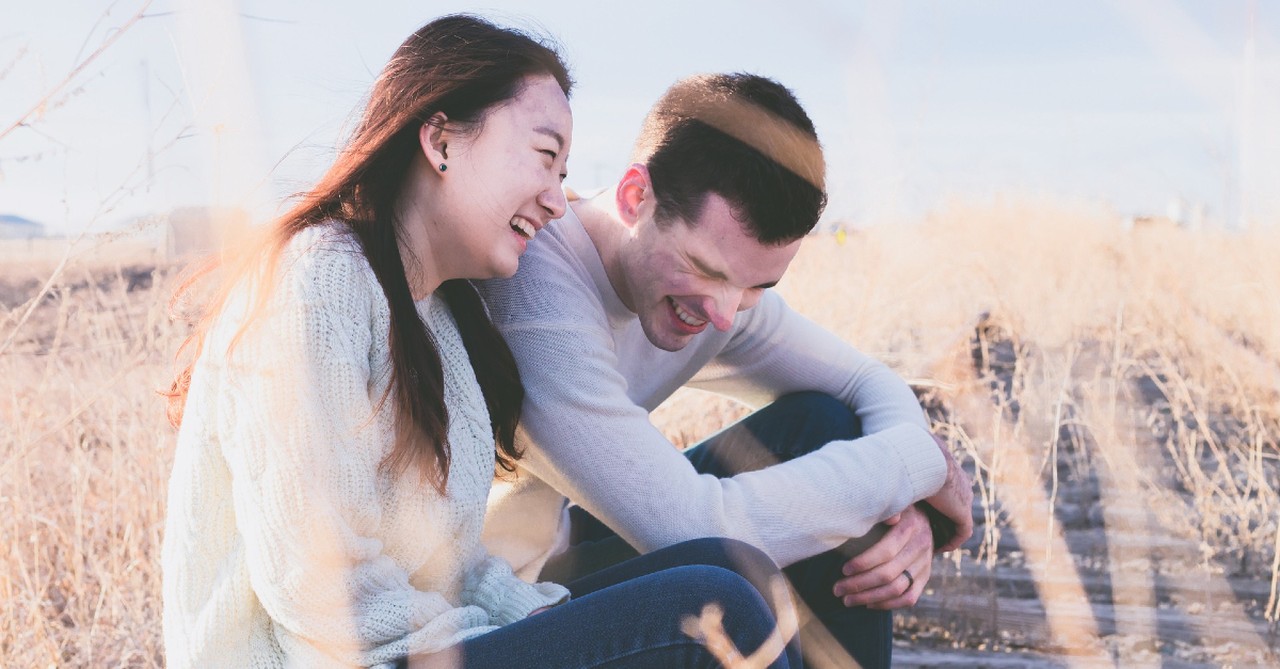 couple laughing outside