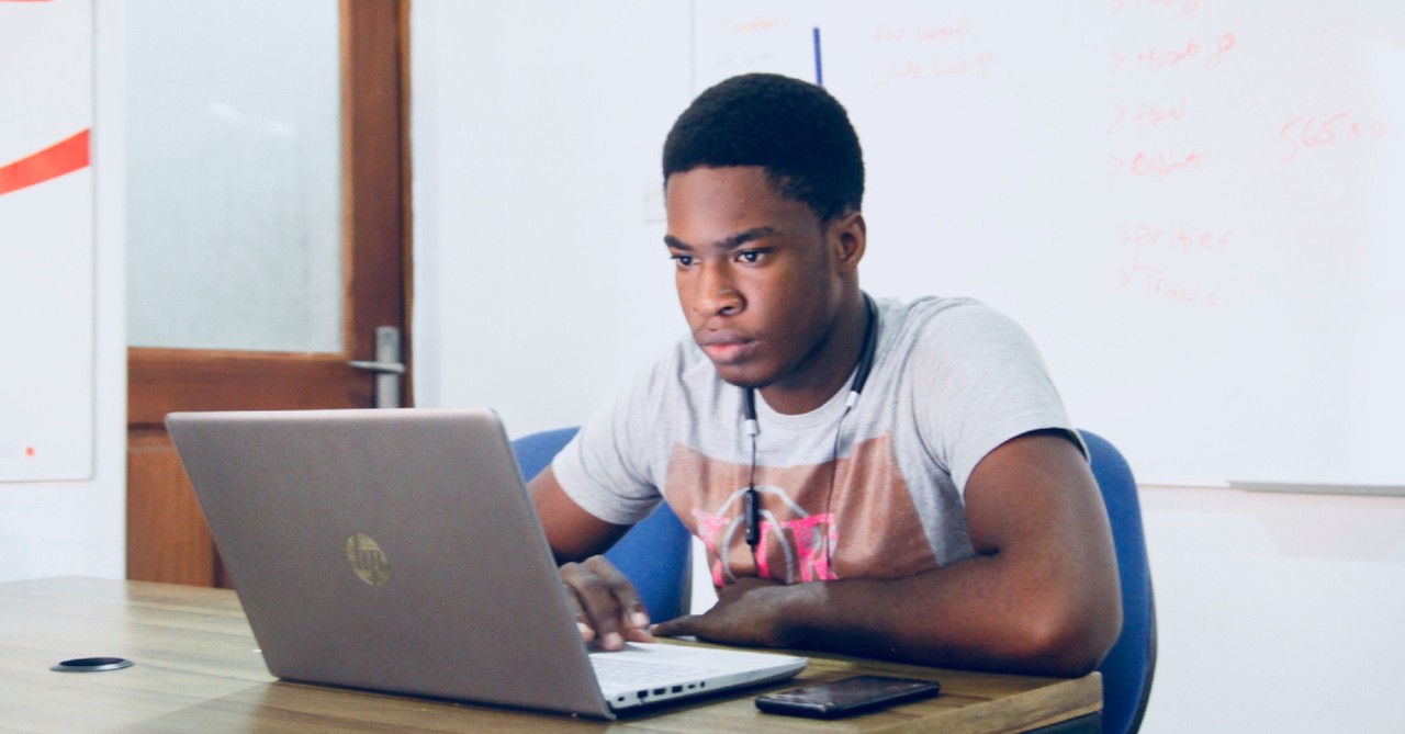 man looking at laptop