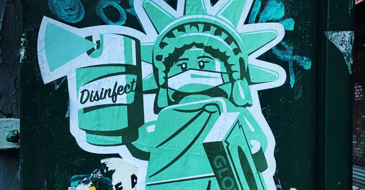 statue of liberty with coronavirus precautions