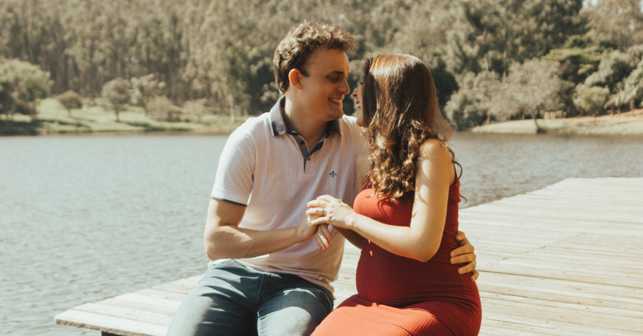 couple sitting by lake