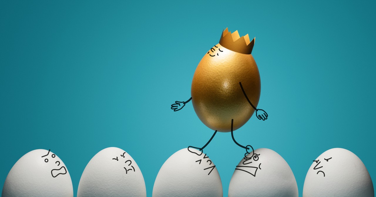 golden egg walking on white eggs conceit selfish