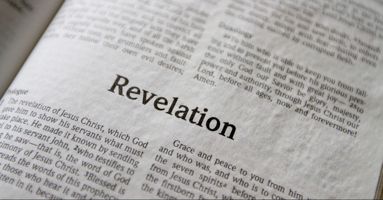 Bible opened to Revelation, verses about the lake of fire