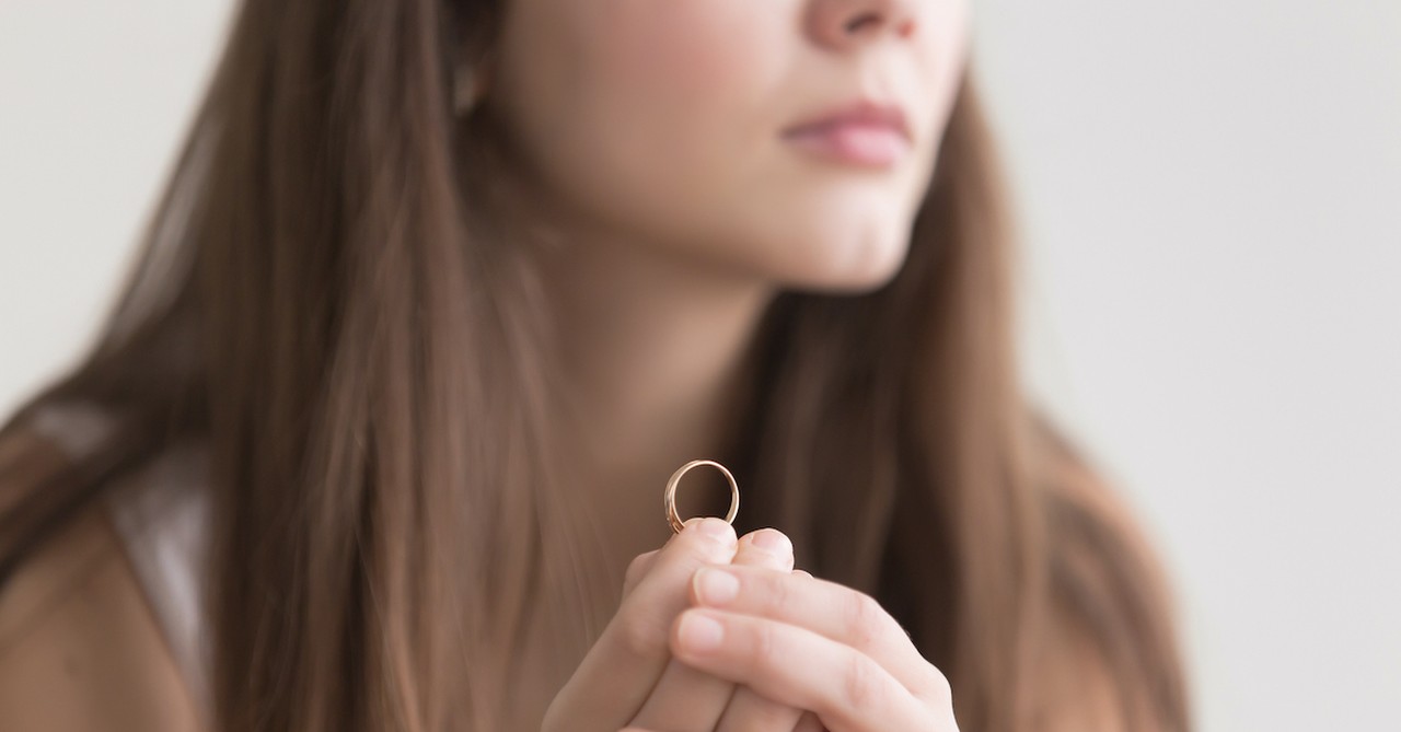 woman holding wedding ring in her hand, what is sexual immorality