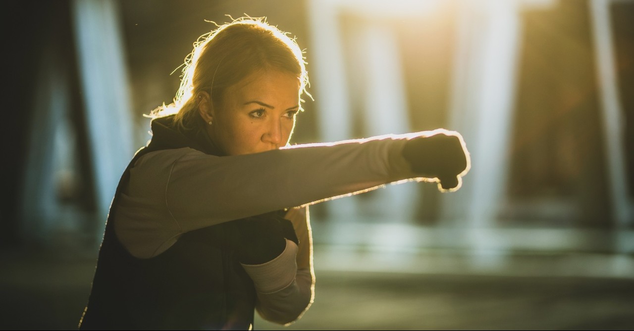 Woman in punching stance, things satan would love you do