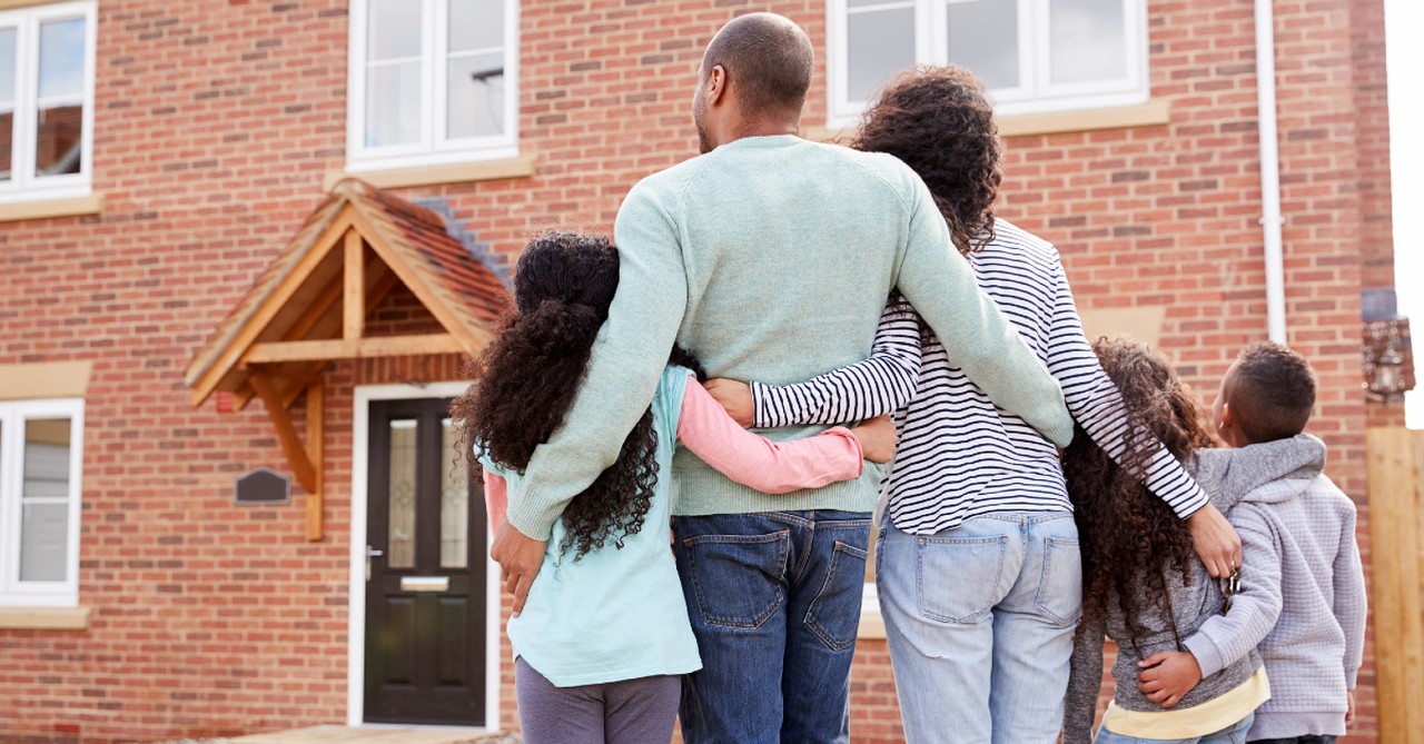 family outside of their house