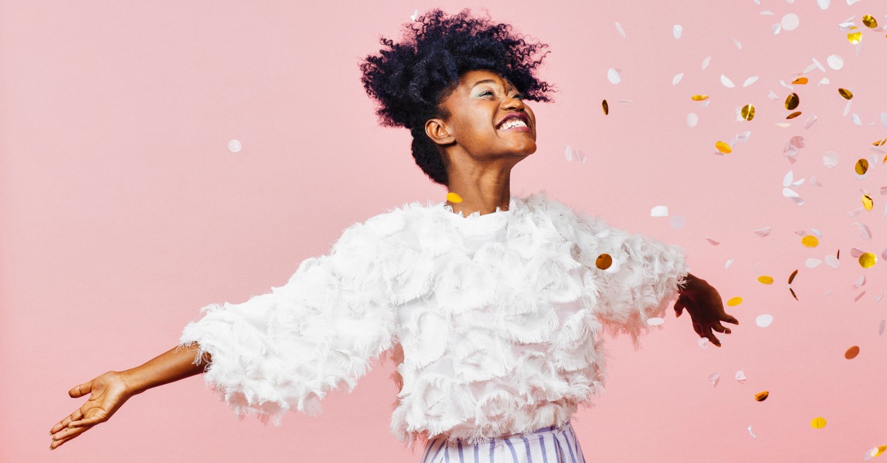 woman joyfully celebrating with confetti