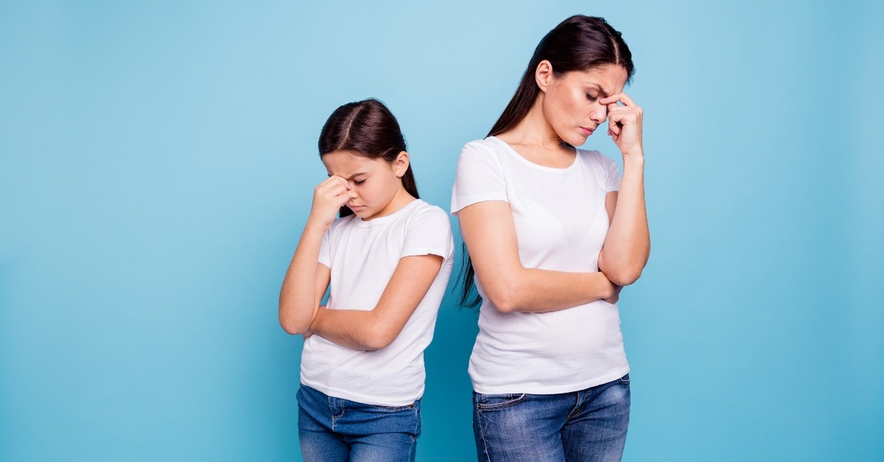 mother and daughter looking stressed and annoyed with each other, tension between you and your children