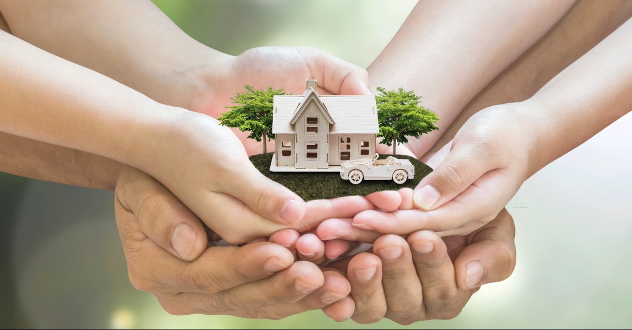 House and car in the hands of a family