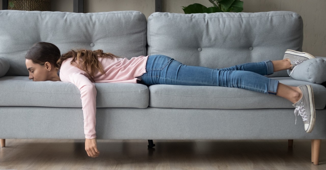 Lazy woman laying on a sofa