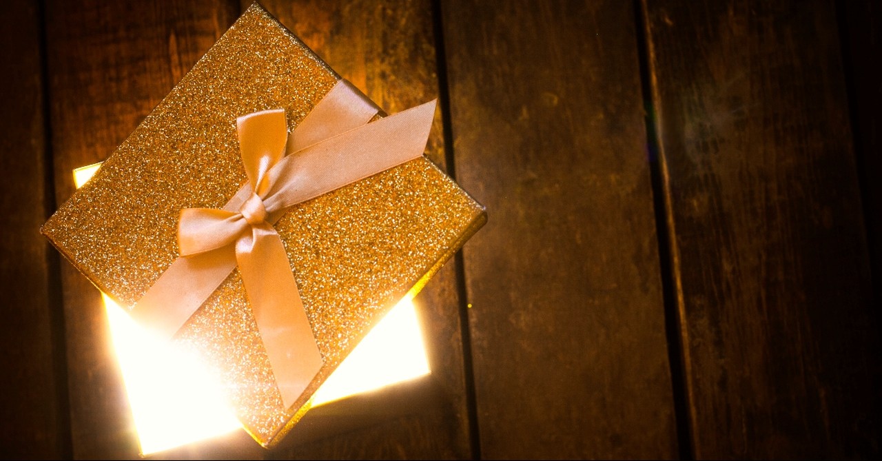 Golden Gift box with a blinding light coming out