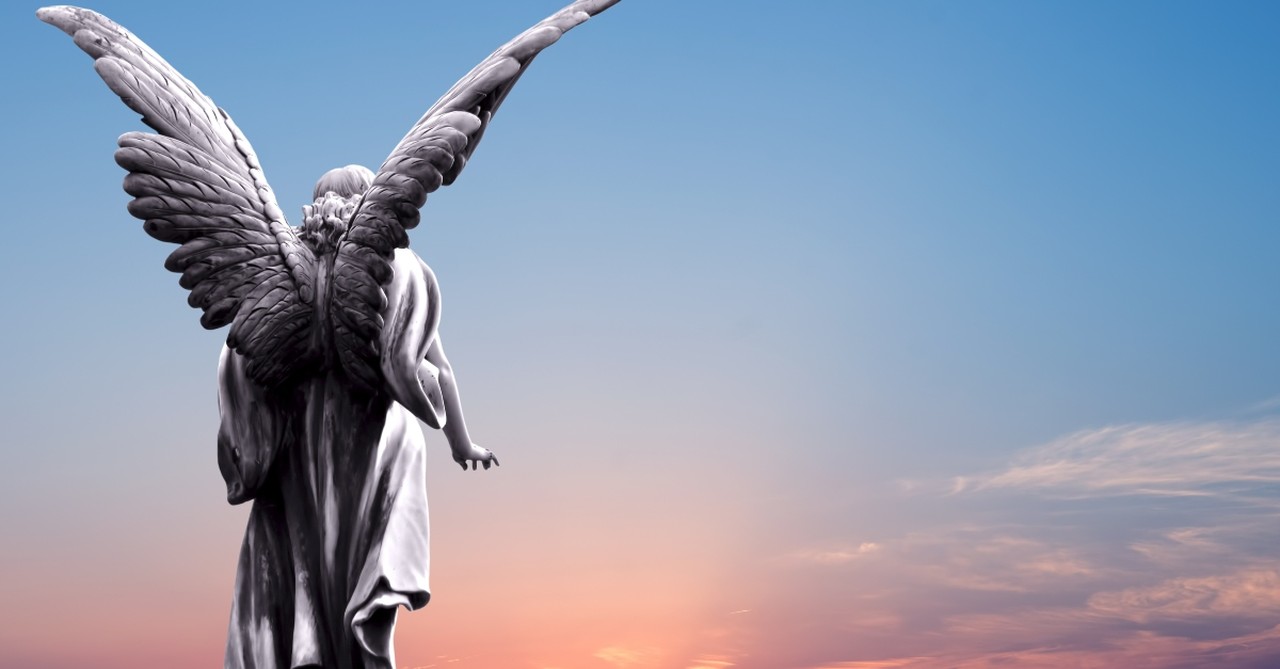 Angel statue looking out over the sky