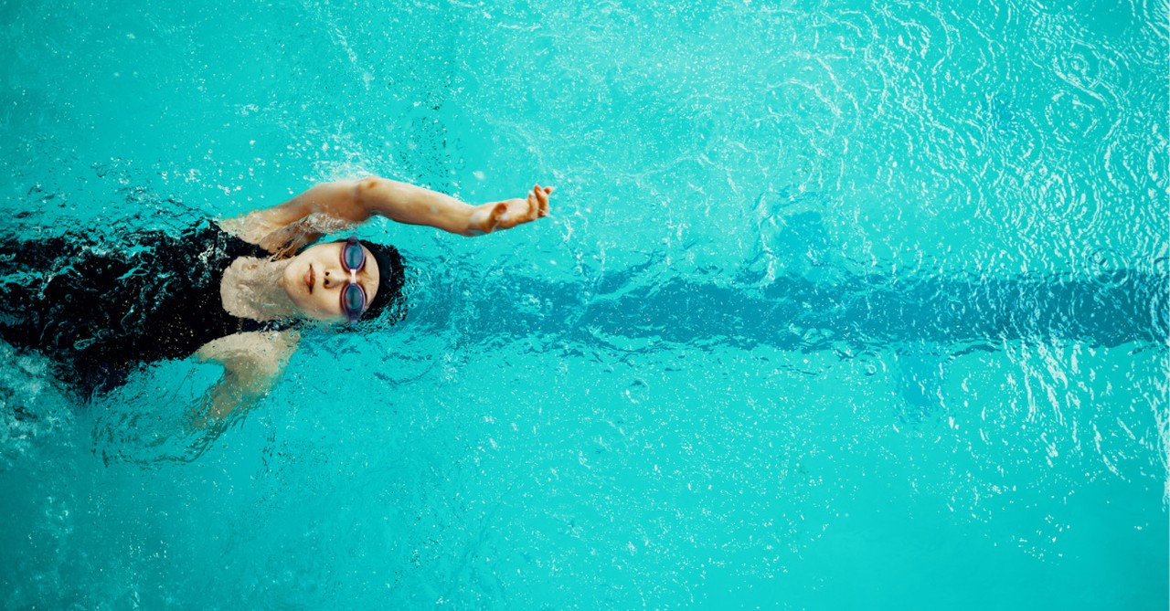 A girl doing a backstroke, bill proposes defunding schools that allow biological males who identify as female to compete in girls' sports