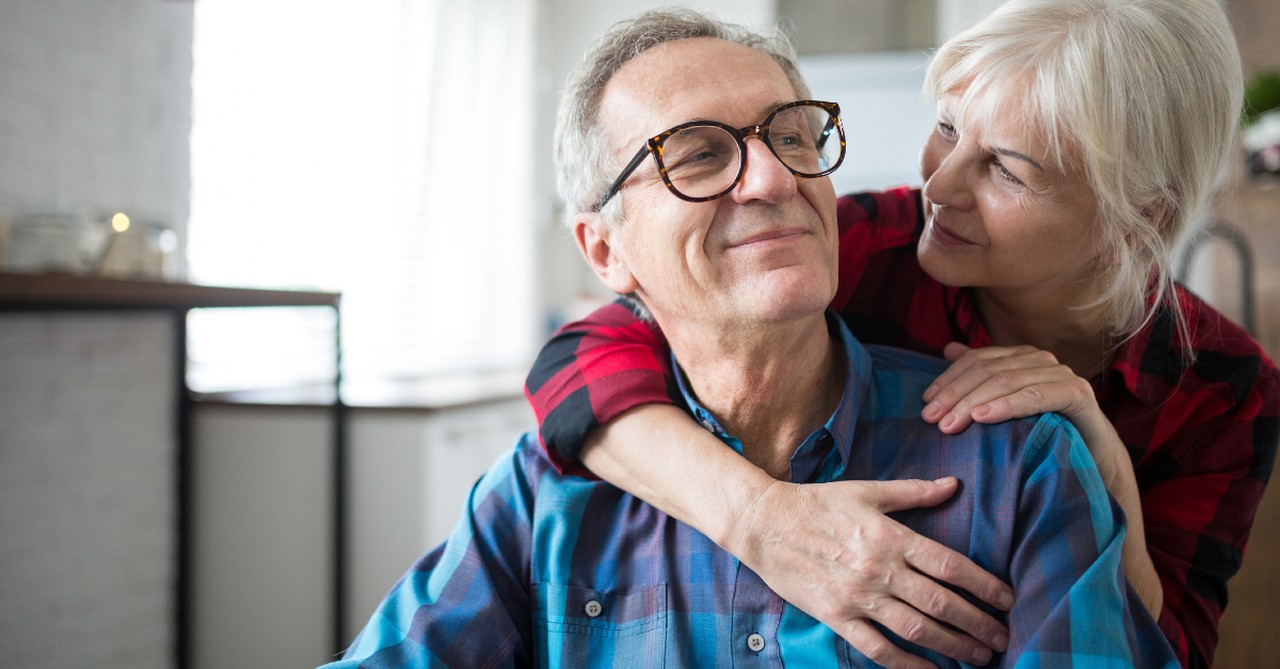 senior couple hugging and smiling