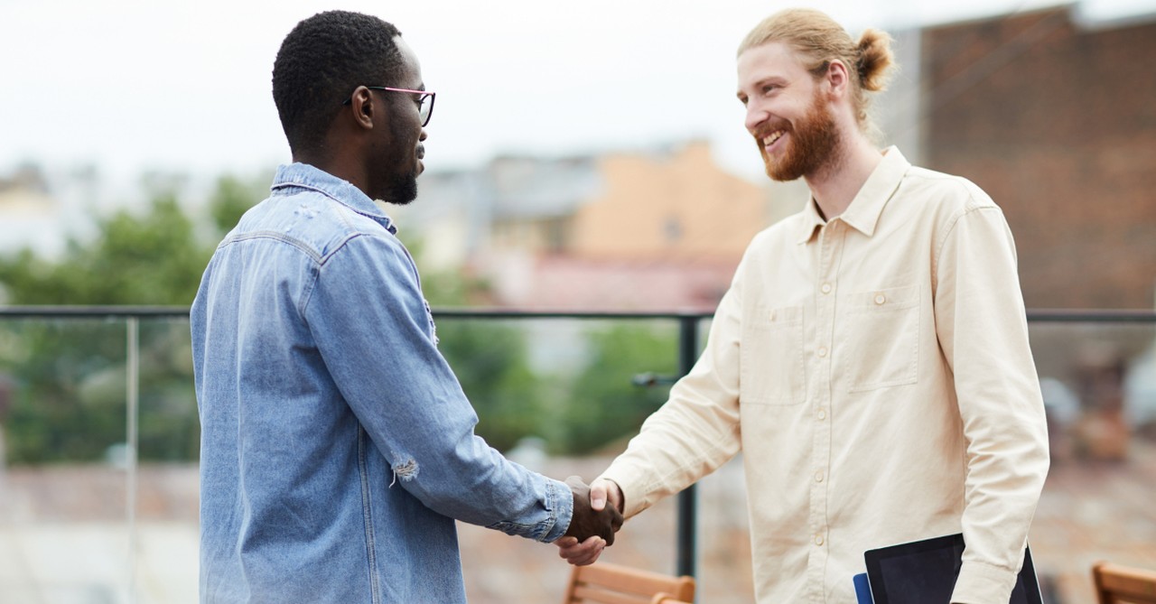 two diverse friends meeting conversation