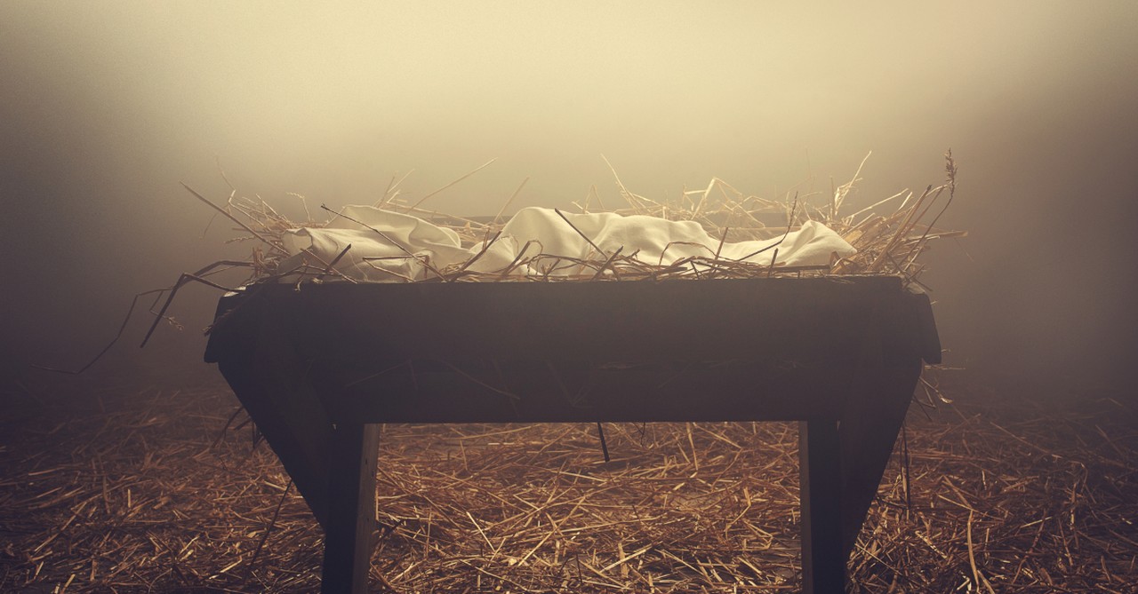 manger filled with hay and a blanket