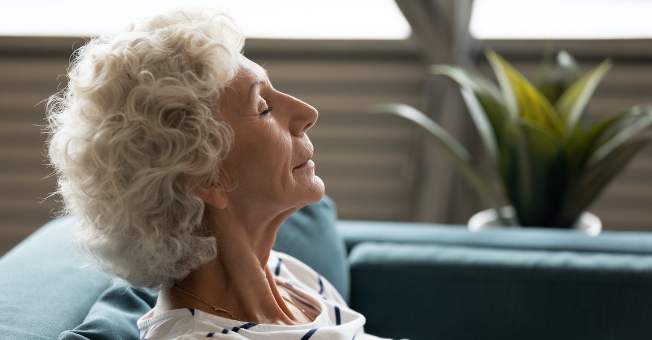 Woman with closed eyes, experience resilient joy and peace