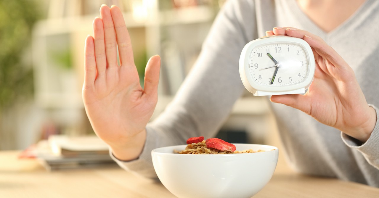 woman refrains from eating cereal, fasting and prayer