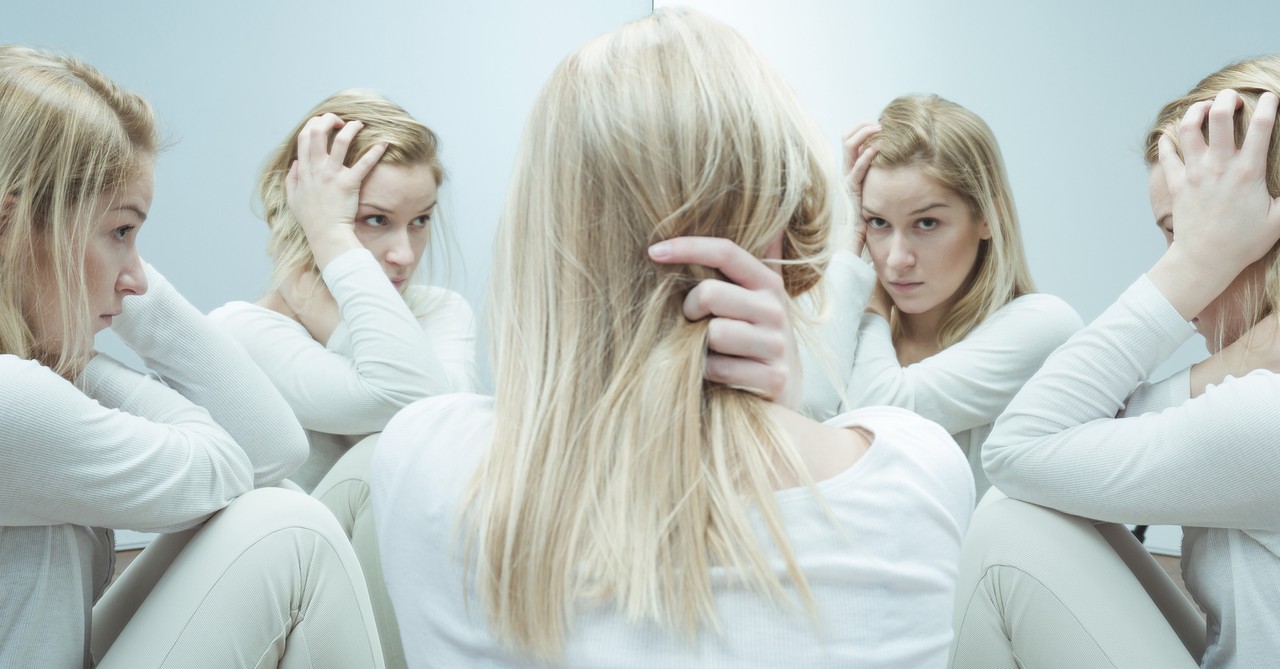 woman looking in the mirror 