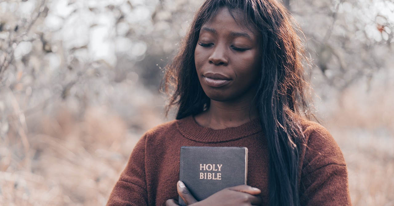 woman holding a bible praying, short prayers