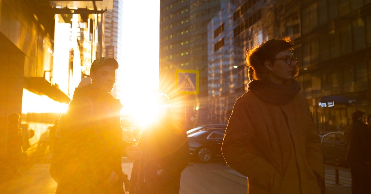 street scene people walking afternoon light