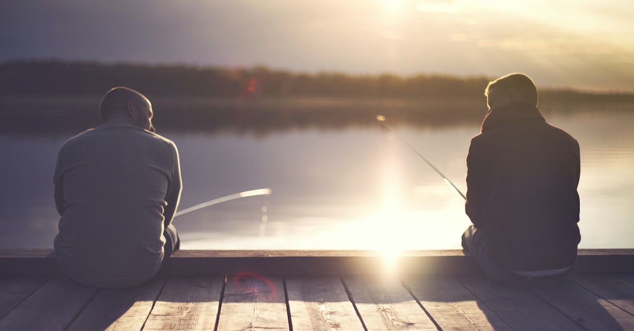 two men fishing on dock at sunset, fishers of men