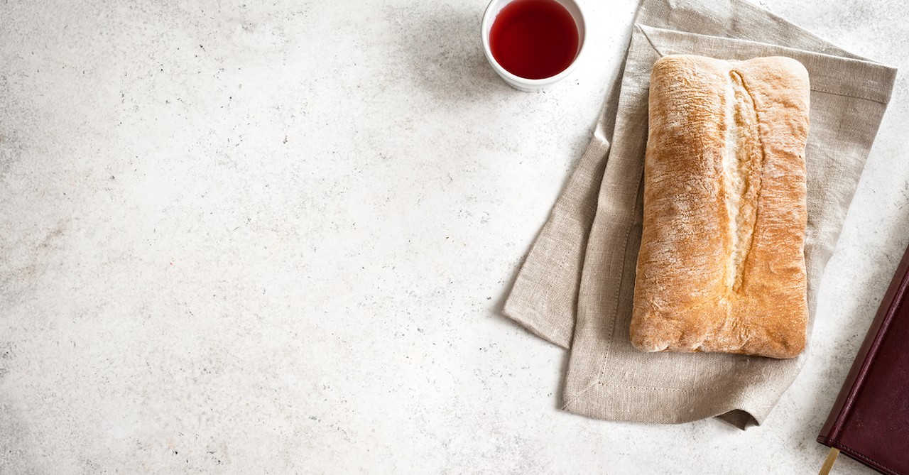 last supper, bread loaf and a cup of wine