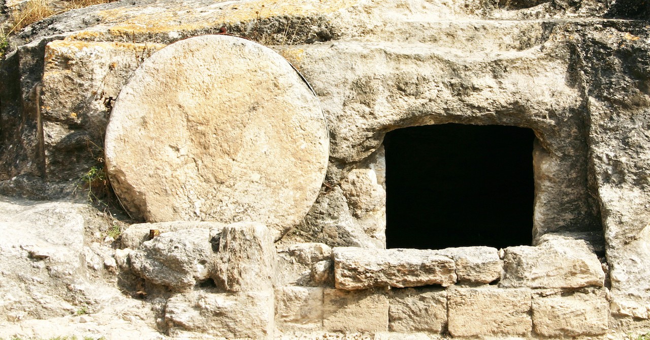 empty tomb cut out of rock in the holy land, holy week symbols