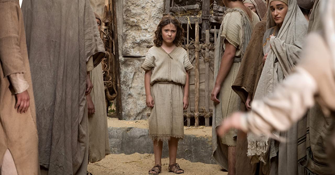 A small child looking concerned at the camera in 'Young Messiah'