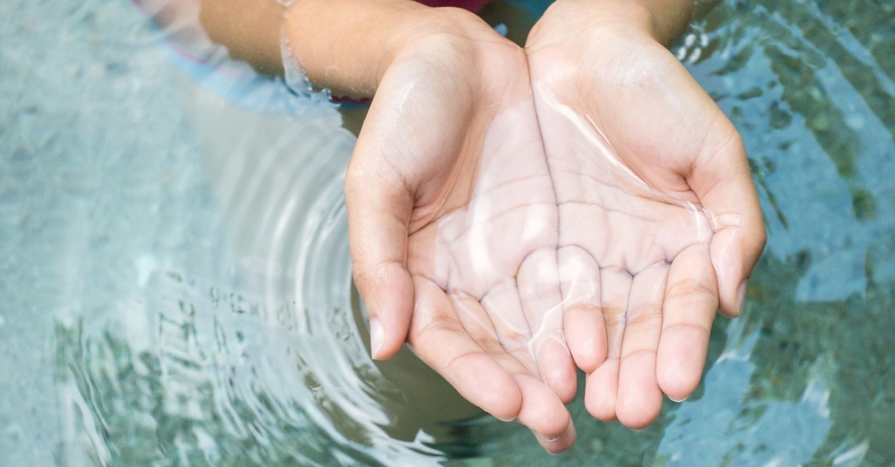 Hands cupping clean water