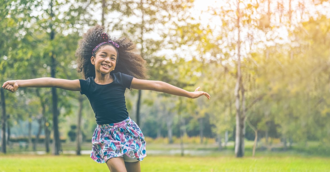 Young girl playing outside