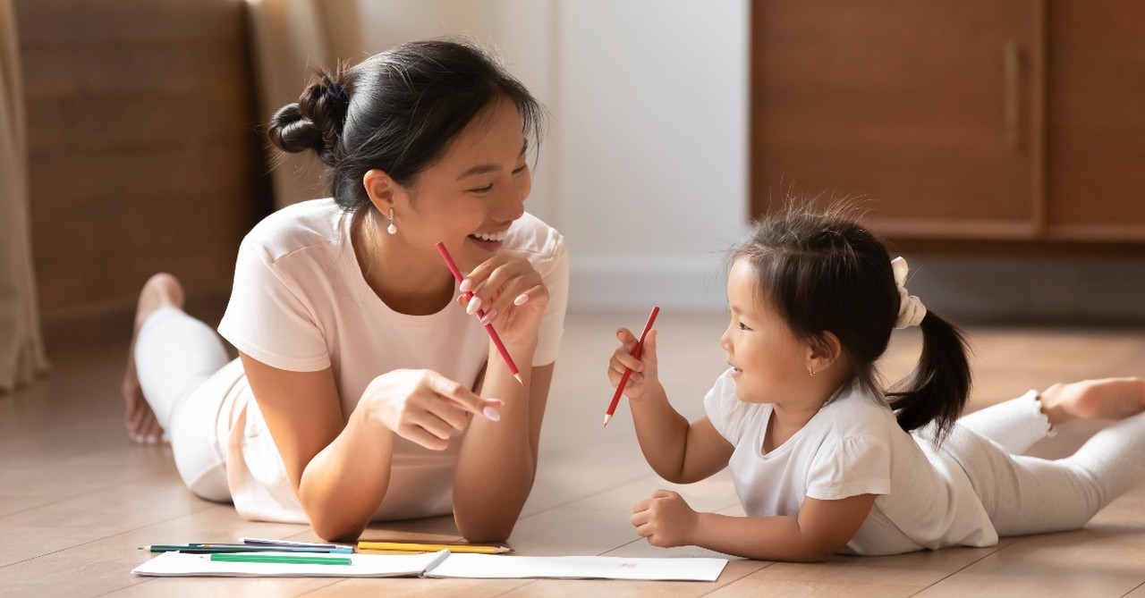 Mother coloring with her daughter